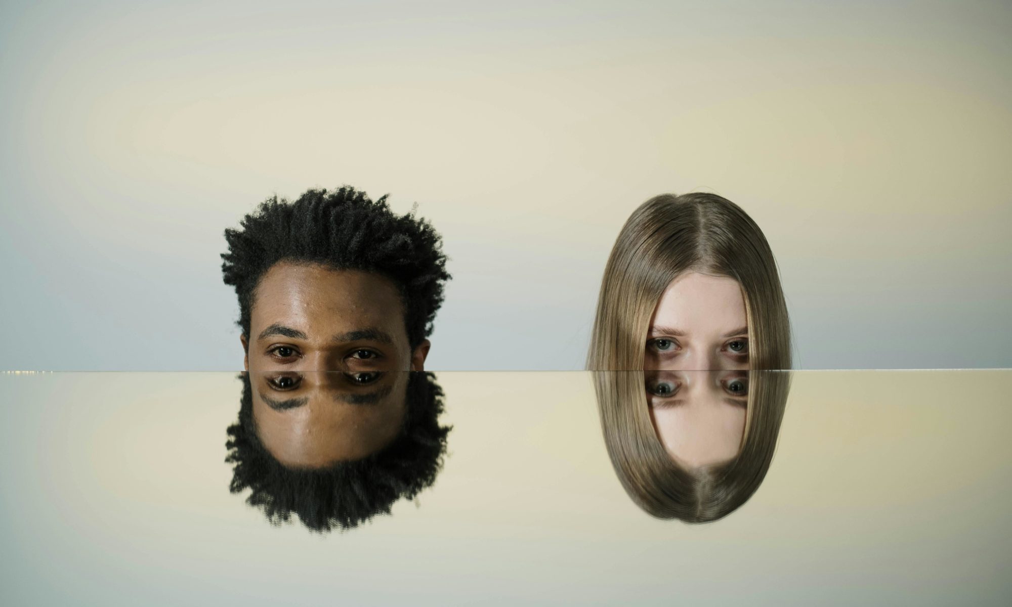 Conceptual illustration of co-parenting with a malignant narcissist, two mirrored faces symbolizing manipulation, control, and the emotional challenges of toxic co-parenting.