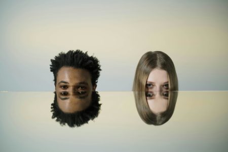 Conceptual illustration of co-parenting with a malignant narcissist, two mirrored faces symbolizing manipulation, control, and the emotional challenges of toxic co-parenting.